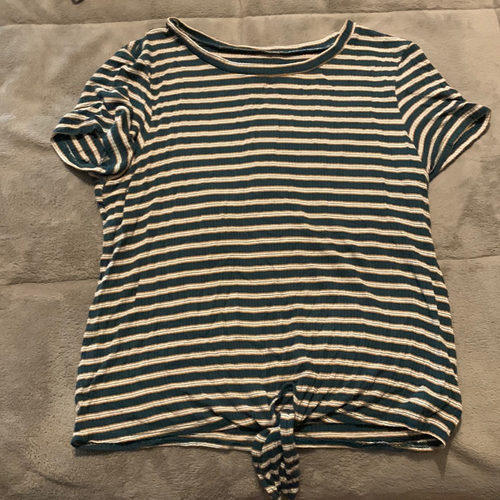 This green, white, and tan striped top is from American Eagle and is a small.